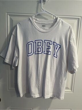 women's obey propaganda boxy oversized fit white shirt with blue logo